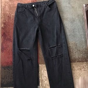 Black jeans with holes in the knees, size large